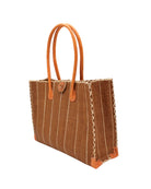 Side view Zafran Tobacco Pinstripes Large Straw Beach Bag with Plastic Liner handmade loomed raffia tote in wide bands of tobacco dark/cinnamon/brown with narrow bands of natural straw color that make a vertical pinstripe pattern with assorted print plastic lining and leather handles xl bag - Shebobo