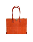 Zafran Two Tone Wide Stripe Coral Pinstripe Straw Beach Bag handmade loomed raffia palm fiber in a solid hue of coral orange/red on the top half of the bag and a multicolor multi-width vertical pinstripe stripe pattern with thin bands of natural straw color with wide bands of coral on the bottom half of the bag with leather handles and feet and matching crosshatch stitch edging shoulder bag - Shebobo