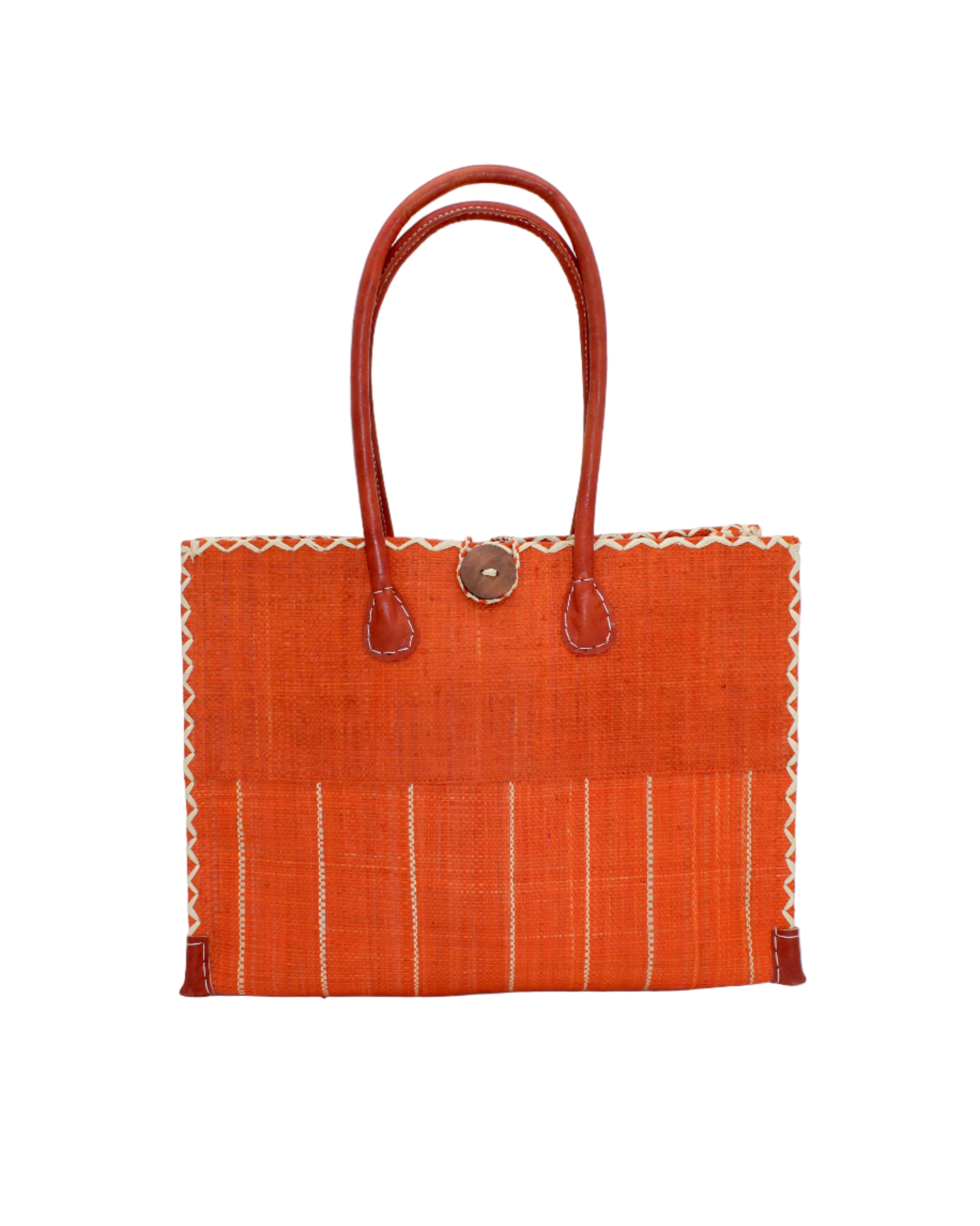 Zafran Two Tone Wide Stripe Coral Pinstripe Straw Beach Bag handmade loomed raffia palm fiber in a solid hue of coral orange/red on the top half of the bag and a multicolor multi-width vertical pinstripe stripe pattern with thin bands of natural straw color with wide bands of coral on the bottom half of the bag with leather handles and feet and matching crosshatch stitch edging shoulder bag - Shebobo