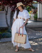 Zafran Natural Pinstripes Large Straw Beach Bag with Plastic Liner handmade loomed raffia tote in wide bands of natural straw color with narrow bands of black that make a vertical pinstripe pattern with assorted print plastic lining and leather handles xl bag - Shebobo (with Bolero Natural Crochet Straw Sun Hat and Lulu Natural Macrame Straw Sandal)