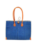 Zafran Straw Beach Bag with Plastic Liner handmade loomed raffia in a solid hue of Azure intense/bright/blue with contrasting natural straw color cross stitch edge binding, wood button closure, and leather handles & feet plus assorted print plastic lining - Shebobo