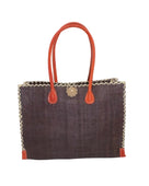 Zafran Straw Beach Bag with Plastic Liner handmade loomed raffia in a solid hue of Mocha dark/chocolate/brown with contrasting natural straw color cross stitch edge binding, wood button closure, and leather handles & feet plus assorted print plastic lining - Shebobo