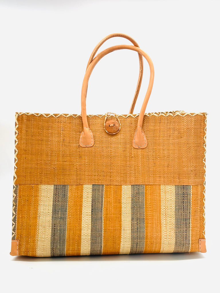 Zafran Two Tone Blush Swirl Multicolor Stripes Beach Straw Bag with Plastic Liner handmade loomed raffia color block with the top half solid blush orange/pink and the bottom half multi width vertical stripes of Blush, Grey, and Natural - sides of bag are same stripe pattern - with wood button and leather handles & accents - Shebobo