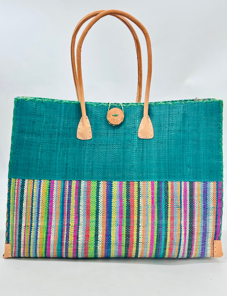 Zafran Two Tone Turquoise Stripes Multicolor Stripes Beach Straw Bag with Plastic Liner handmade loomed raffia color block with the top half solid turquoise blue and the bottom half multi width vertical stripes of Black, Grey, natural, purple, pink, blue, green, yellow, orange, etc. - sides of bag are same stripe pattern - with wood button and leather handles & accents - Shebobo