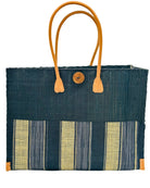 Zafran Two Tone Wide Stripe Black Swirl Straw Beach Bag handmade loomed raffia palm fiber in a solid hue of black on the top half of the bag and a multicolor multi-width vertical stripe pattern of black, grey, and natural straw color on the bottom half of the bag with leather handles and feet and matching crosshatch stitch edging shoulder bag - Shebobo