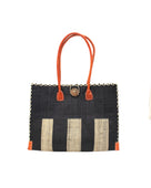 Zafran Two Tone Wide Stripe Black and Natural Straw Beach Bag handmade loomed raffia palm fiber in a solid hue of black on the top half of the bag and a two tone even width vertical wide stripe pattern of black and natural straw color on the bottom half of the bag with leather handles and feet and matching crosshatch stitch edging shoulder bag - Shebobo