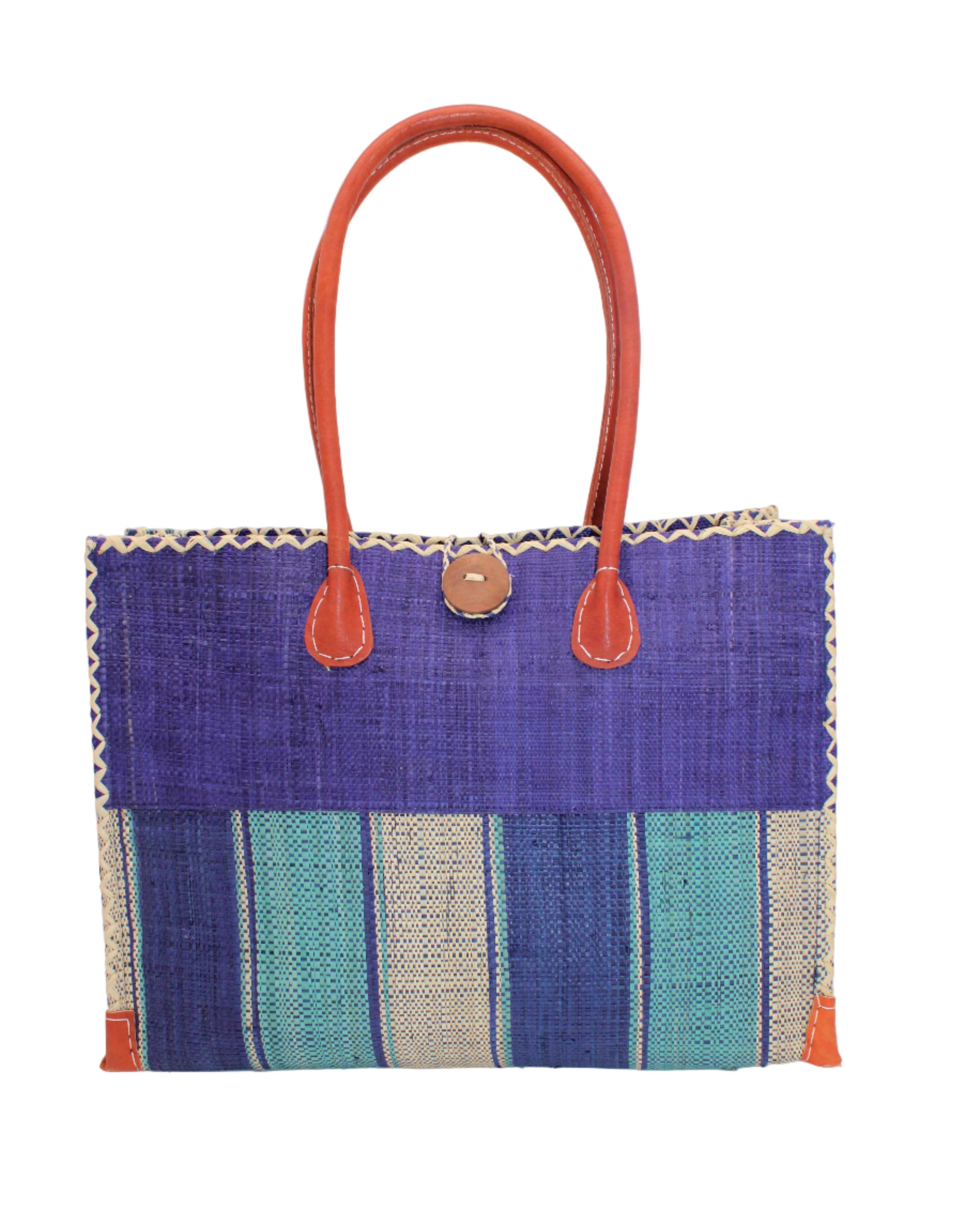 Zafran Two Tone Wide Stripe Blue Swirl Straw Beach Bag handmade loomed raffia palm fiber in a solid hue of dusk/navy/dark blue on the top half of the bag and a multicolor multi-width vertical stripe pattern of blue, turquoise, and natural straw color on the bottom half of the bag with leather handles and feet and matching crosshatch stitch edging shoulder bag - Shebobo