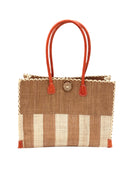 Zafran Two Tone Wide Stripe Cappuccino and Natural Straw Beach Bag handmade loomed raffia palm fiber in a solid hue of cappuccino light/brown/beige on the top half of the bag and a two tone even width vertical wide stripe pattern of cappuccino and natural straw color on the bottom half of the bag with leather handles and feet and matching crosshatch stitch edging shoulder bag - Shebobo