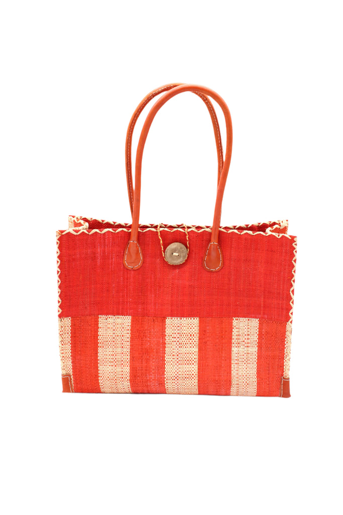 Zafran Two Tone Wide Stripe Coral and Natural Straw Beach Bag handmade loomed raffia palm fiber in a solid hue of coral orange/red on the top half of the bag and a two tone even width vertical wide stripe pattern of coral and natural straw color on the bottom half of the bag with leather handles and feet and matching crosshatch stitch edging shoulder bag - Shebobo
