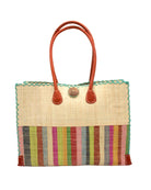 Zafran Two Tone Wide Stripe Lollipop Stripe Straw Beach Bag handmade loomed raffia palm fiber in a solid hue of Natural straw color on the top half of the bag and a multicolor multi-width vertical stripe pattern of black, lime green, grass green, red, light/soft/baby pink, yellow, grey, whisky caramel/red/brown, light blue, fuchsia hot/bright/barbie/pink, and natural straw color on the bottom half of the bag with leather handles and feet and matching crosshatch stitch edging shoulder bag - Shebobo