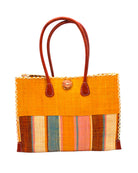 Zafran Two Tone Wide Stripe Pink Blue Swirl Straw Beach Bag handmade loomed raffia palm fiber in a solid hue of Saffron yellow/orange on the top half of the bag and a multicolor multi-width vertical stripe pattern of black, soft/light/baby pink, light blue, saffron, and natural straw color on the bottom half of the bag with leather handles and feet and matching crosshatch stitch edging shoulder bag - Shebobo