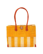 Zafran Two Tone Wide Stripe Saffron and Natural Straw Beach Bag handmade loomed raffia palm fiber in a solid hue of saffron yellow/orange on the top half of the bag and a two tone even width vertical wide stripe pattern of saffron and natural straw color on the bottom half of the bag with leather handles and feet and matching crosshatch stitch edging shoulder bag - Shebobo