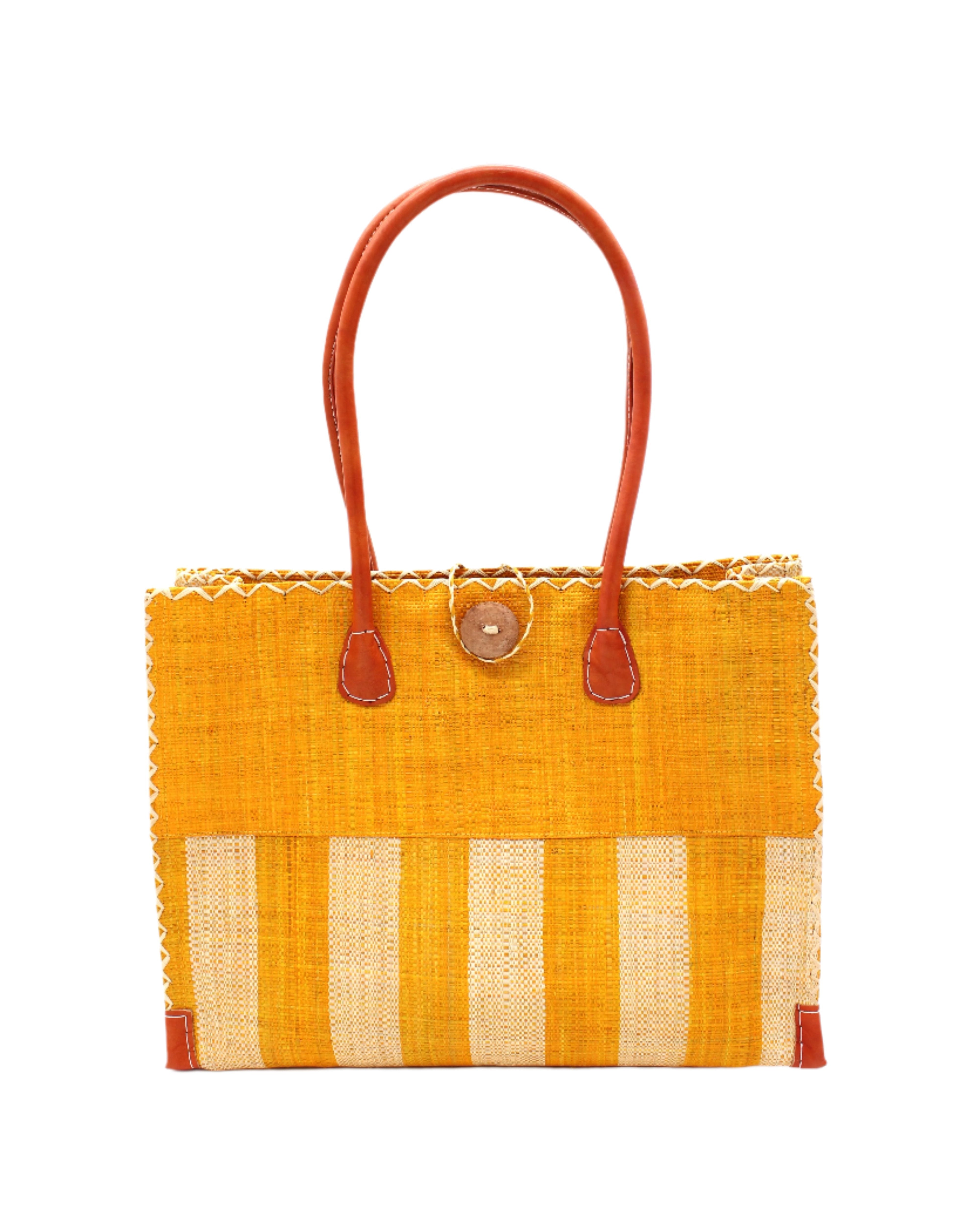 Zafran Two Tone Wide Stripe Saffron and Natural Straw Beach Bag handmade loomed raffia palm fiber in a solid hue of saffron yellow/orange on the top half of the bag and a two tone even width vertical wide stripe pattern of saffron and natural straw color on the bottom half of the bag with leather handles and feet and matching crosshatch stitch edging shoulder bag - Shebobo
