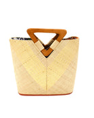 Zuki Wynwood Natural Straw Handbag with Metallic Detailing & Wood Triangle Handle handmade loomed raffia palm fiber in a solid hue of natural straw color with incorporated vegan leather  gold metallic strands in a V pattern across the front and back of the bag with assorted print African wax cloth liners and carved wooden triangle handle purse - Shebobo