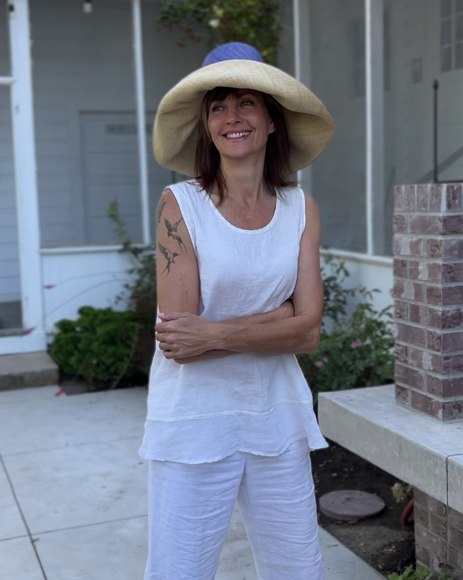 Model wearingMonica  7" Brim Two Tone Denim Straw Hat handmade loomed raffia color block pattern of the top half denim retro/light/blue and the bottom half natural straw color - Shebobo