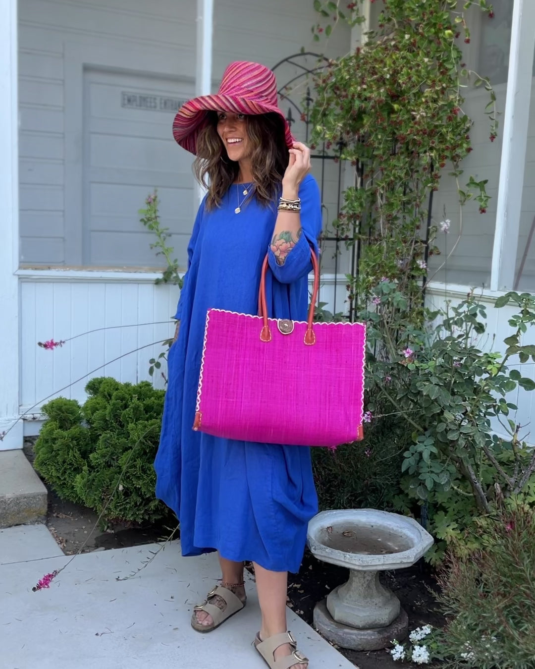 Zafran Straw Beach Bag with Plastic Liner handmade loomed raffia in a solid hue of Fuchsia hot/bright/barbie/pink with contrasting natural straw color cross stitch edge binding, wood button closure, and leather handles & feet plus assorted print plastic lining - Shebobo (with Monica 5" & 7" Wide Brim Very Berry Multicolor Melange Pattern Packable Straw Sun Hats)