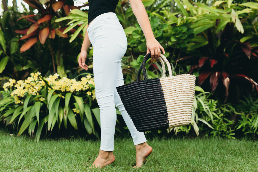 Model wearing Avalone two tone black and natural color block pattern raffia straw handbag basket bag - Shebobo