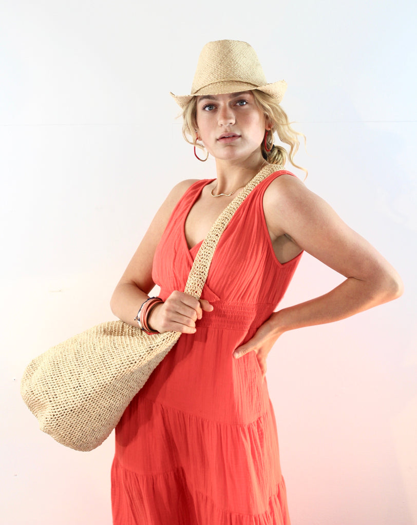 Model wearing Kiki handmade crochet natural raffia straw crossbody beach bag purse - Shebobo