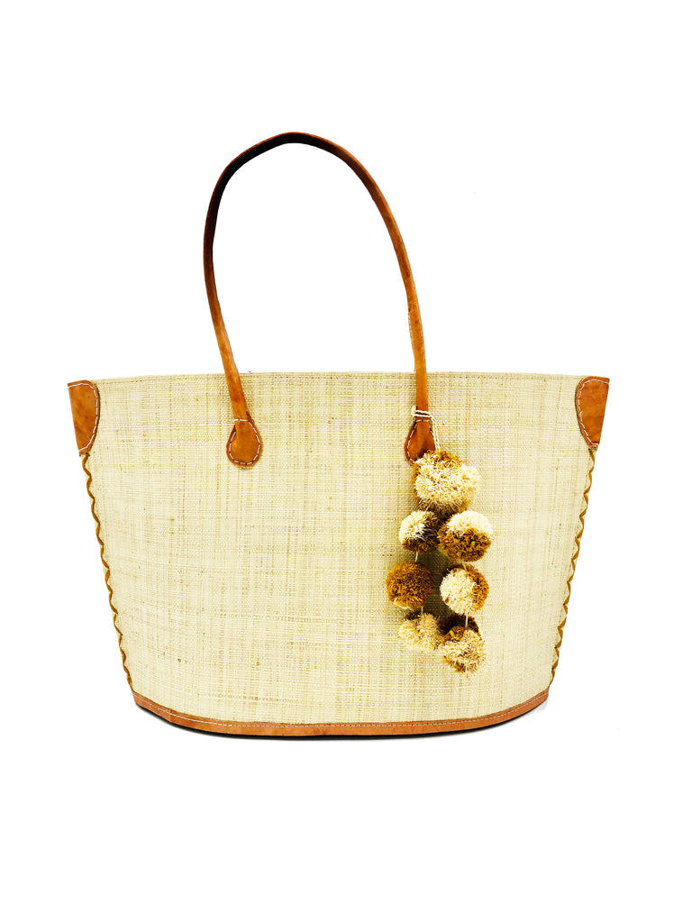 Melanga straw tote bag with waterfall pompom bag charm embellishment handmade natural straw color loomed raffia handbag with leather handles beach bag purse - Shebobo